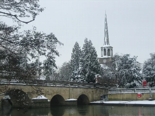 Snow-covered bridge and church tower in Wallingford, Oxfordshire.