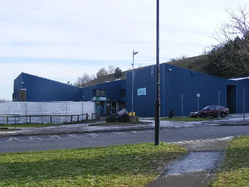 Blue leisure centre building with parking area in Midsomer Norton.