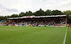 View of the South Stand at the Lamex Stadium with spectators.