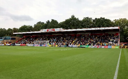 View of the South Stand at the Lamex Stadium with spectators.