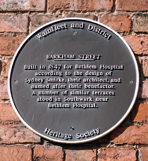 Plaque on a street of 'London town houses' reputedly built in error at Wainfleet Lincolnshire. Original image edited in Photoshop CS2.