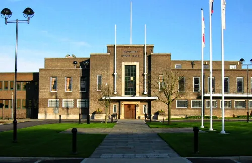 Town hall building with flagpoles and pathway in Romford.