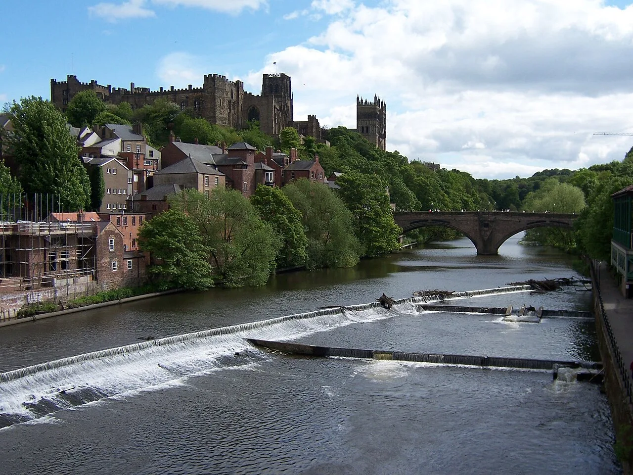River Wear with bridges, trees, and historic buildings in Durham.