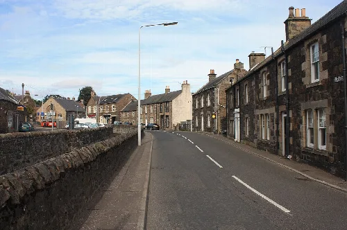 Stone houses along a curved street in old Auchtermuchty.