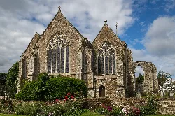 Gothic church with large stained glass windows and stone walls in Winchelsea.