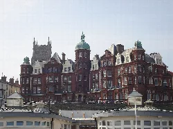 A large Victorian-style hotel with turrets and a red brick facade in Cromer.