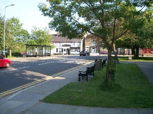 Benches and a bus shelter in the centre of Crook, County Durham.
