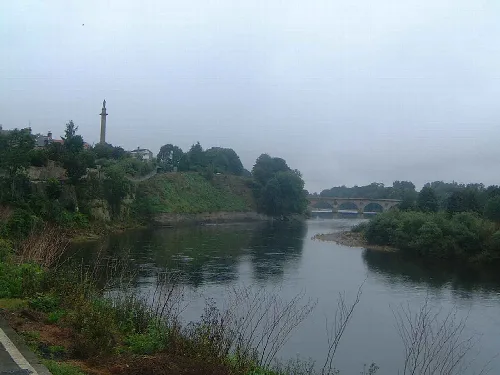 River Tweed with a bridge and monument in Coldstream.