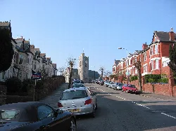 Street view of Barry with All Saints Church at the top of the hill.
