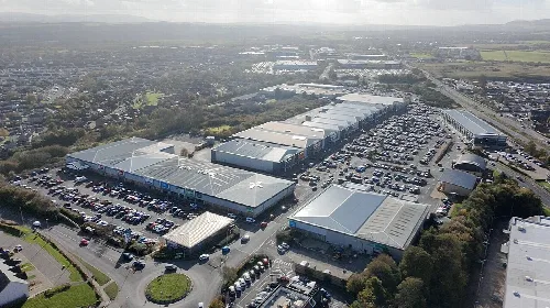 Drone imagery of Straiton Mains retail park, Loanhead.