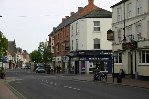 View of Driffield High Street with shops and pedestrians.
