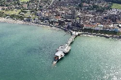 Aerial view of Cromer with pier and teal sea.