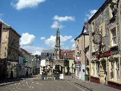 Empty street with market cross and historic buildings in Shepton Mallet.