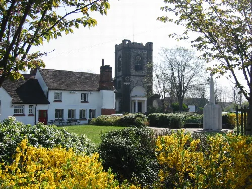 Village green with church, war memorial, and pub in Dagenham.