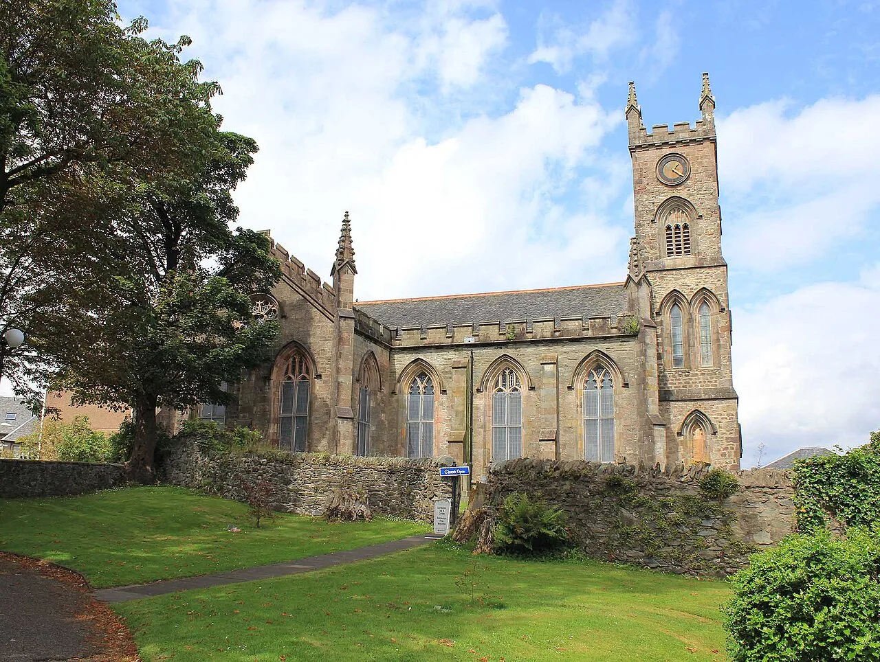 Stone church with tall tower and Gothic windows in Dunoon.