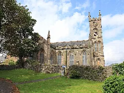 Stone church with tall tower and Gothic windows in Dunoon.